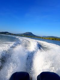 White foam of water and splashing water from the back of a speedboat. speedboat holiday moments