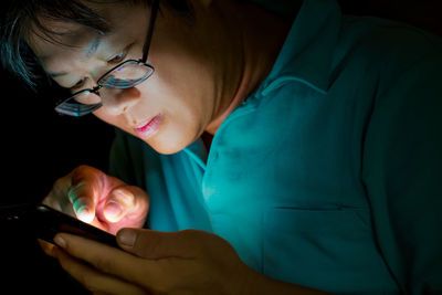 Close-up of woman using mobile phone