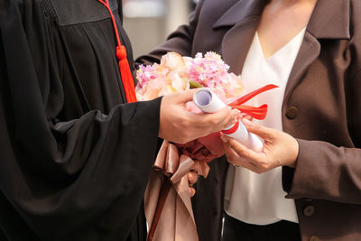 Cropped image of university student graduating 