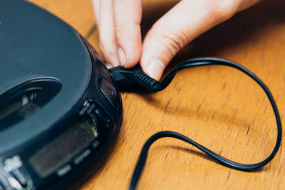 High angle view of person using smart phone on table