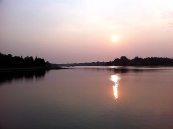 Scenic view of lake at sunset