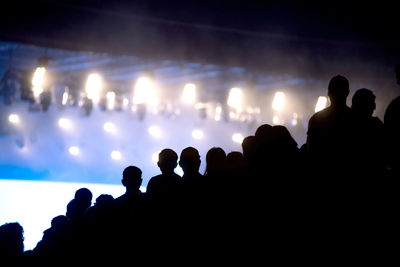 Silhouette people at music concert