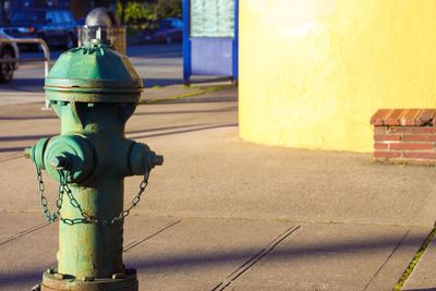 Close-up of fire hydrant against cityscape