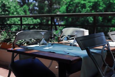 Chairs and table against trees