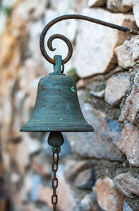 Close-up of rusty metal against rock