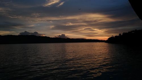 Scenic view of lake against sky during sunset