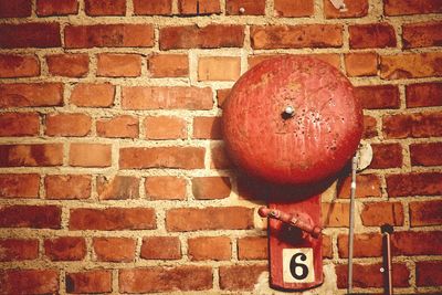 Close-up view of red brick wall