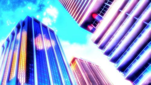 Low angle view of modern building against blue sky