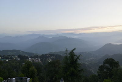 Scenic view of mountains against sky at sunset