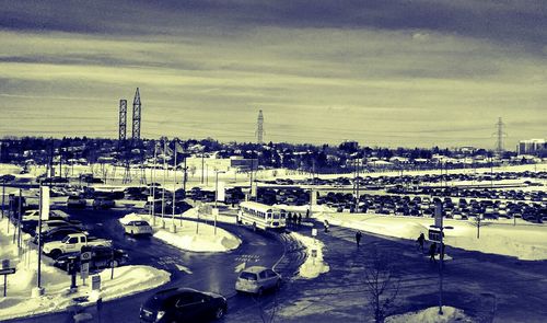 Harbor against cloudy sky