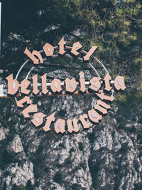 High angle view of text on rock