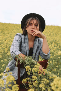 Young woman wearing hat on field