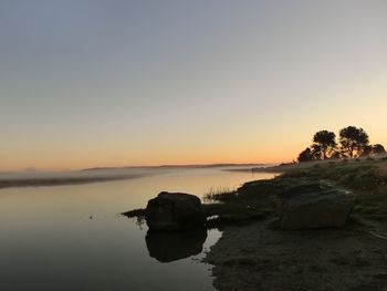 Scenic view of sea against sky during sunset