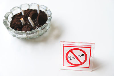 Close-up of cigarette against white background