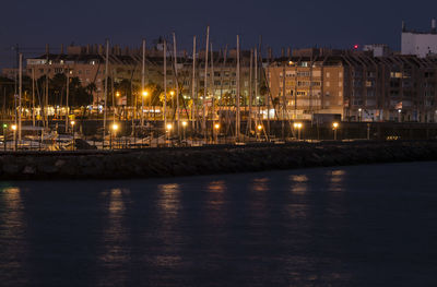 Harbor of almeria , spain, at night, with ships and street light