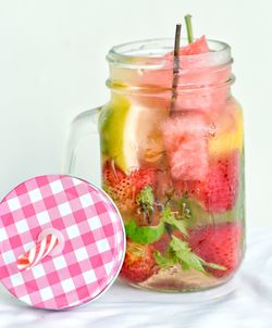 Close-up of drink in glass jar on table