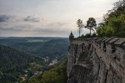 Scenic view of mountain against cloudy sky