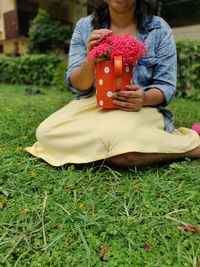 Woman sitting on field