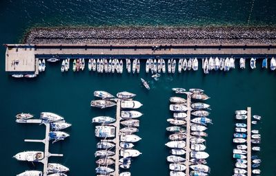 High angle view of boats moored at harbor