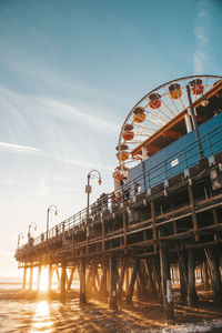 Low angle view of ferris wheel against sky on santa monica pier