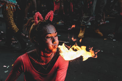 Portrait of young man with fire