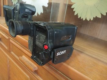 Close-up of camera on table at home