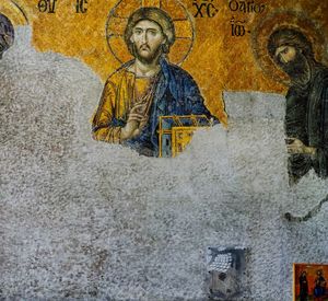 Portrait of man standing against yellow wall