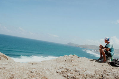 Full length of man on beach against sky