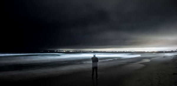 Scenic view of sea against sky at night