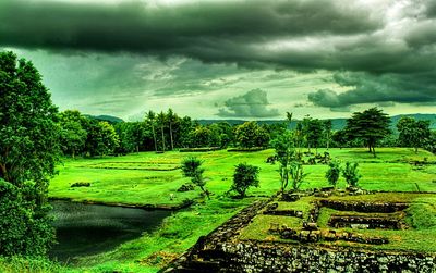 Scenic view of landscape against cloudy sky