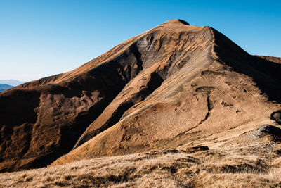 Low angle view of rock formations in desert against sky in amatrice, lazio italy 