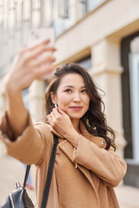 Portrait of young woman looking away