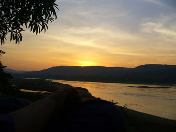 Scenic view of lake at sunset