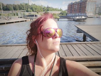 Portrait of young woman in sunglasses