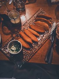 High angle view of breads in tray on table