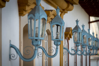 Low angle view of metal gate against building