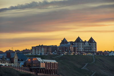 High angle view of buildings against sky during sunset