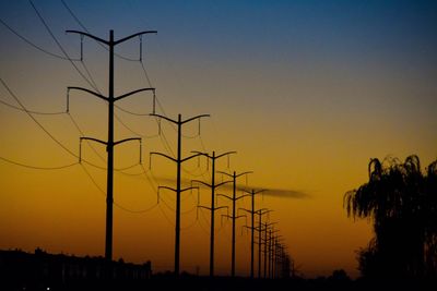 Low angle view of silhouette trees against sky during sunset