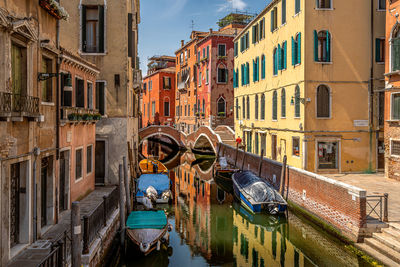 Boats moored in canal