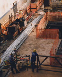 High angle view of people working on building