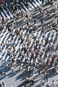 High angle view of people walking on city street