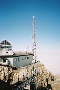 View of buildings against clear blue sky