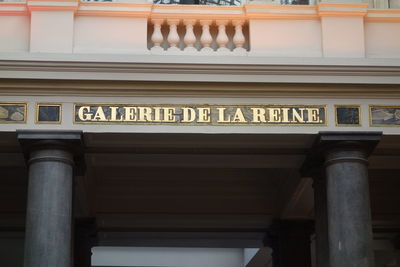 Low angle view of text on building