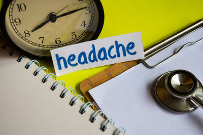 High angle view of clock on table