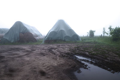 Built structure on field against clear sky