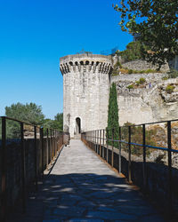 View of old building against clear blue sky