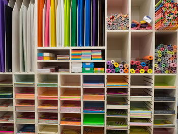 Multi colored books in shelf at store