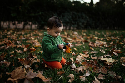 Full length of boy on field during autumn