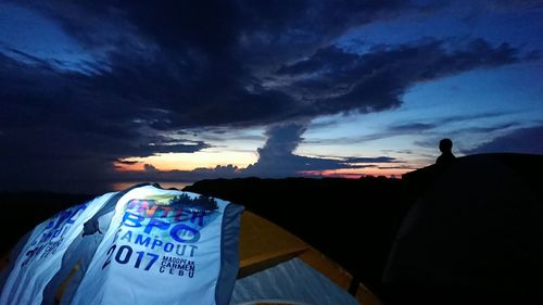 Text on blue sky during sunset