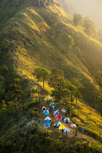 High angle view of people sitting on mountain